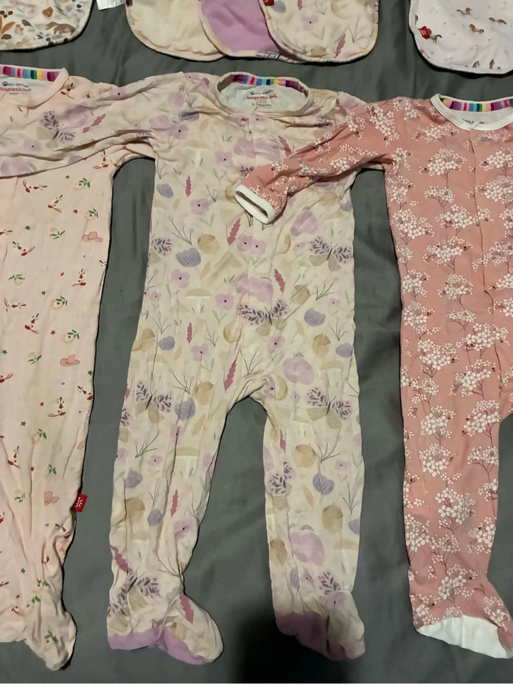 3 magnetic me modal footsies and 6 magnetic me bibs.